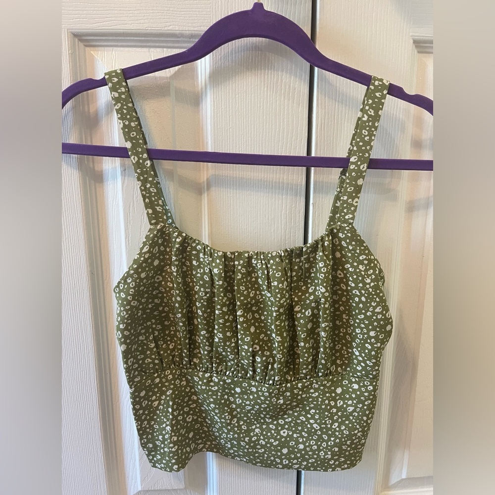 Dusty green cropped tank with a white speckled pattern and ruched detail.